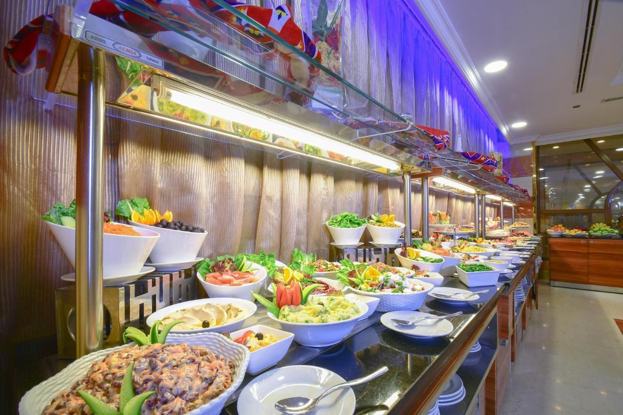 Al Ansar Golden Tulip Hotel Medina Bagian luar foto
